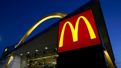 The McDonald's restaurant logo and golden arch is lit up, April 20, 2006, in Chicago. On Saturday, Sept. 30, 2023, a federal judge in New York dismissed a lawsuit that accused McDonald’s and Wendy’s of misleading consumers with ads that show bigger, juicier burgers than their restaurants actually serve.