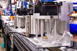 Roller-based line moves heavy motors through both automated and manual stages of assembly.