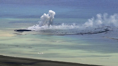 In this aerial photo, plume billows from the water off the Ioto island, following an eruption in Ogasawara, southern Tokyo, Japan, on Oct. 30, 2023. An unnamed undersea volcano, located about 1 kilometer (half a mile) off the southern coast of Iwo Jima, which Japan calls Ioto, started its latest series of eruptions on Oct. 21.