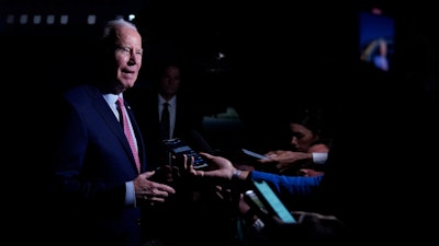 President Joe Biden speaks to members of the media before boarding Air Force One in Norfolk, Va., Nov. 19, 2023.