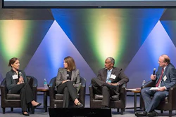 XMO PEI co-chair Stephan Biller (right) leads a panel discussion with industry leaders on building resiliency in U.S. manufacturing and operations.