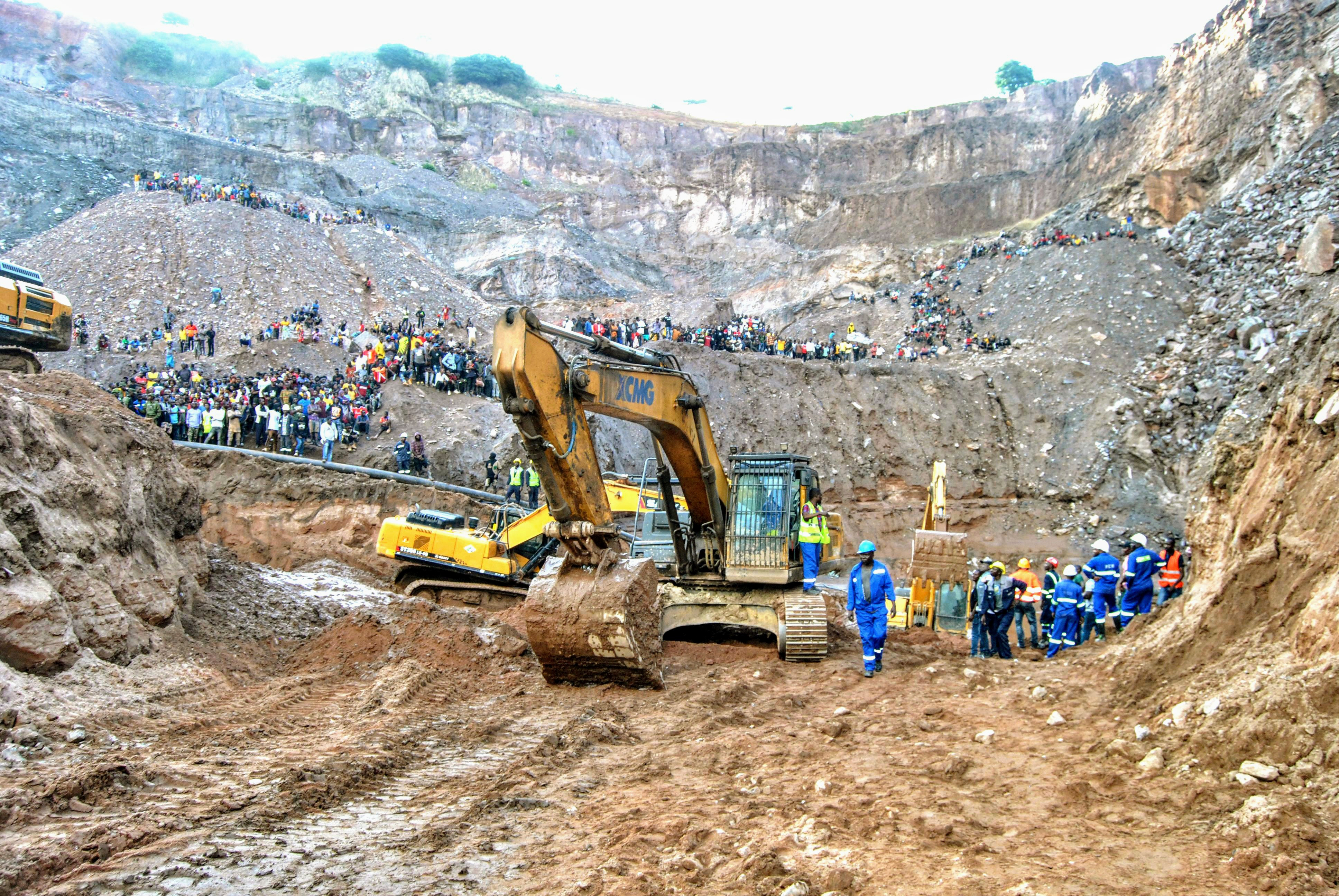 Excavators and people surround the scene of the miners rescue operation on Sunday, Dec. 3, 2023 in Chingola, around 400 kilometers (248 miles) north of the capital Lusaka, Zambia.