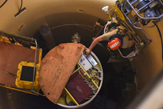 In this image provided by the U.S. Air Force, Airman 1st Class Jackson Ligon, 341st Missile Maintenance Squadron technician, examines the internals of an intercontinental ballistic missile during a simulated electronic launch Minuteman test Sept. 22, 2020, at a launch facility near Malmstrom Air Force Base in Great Falls, Mont.