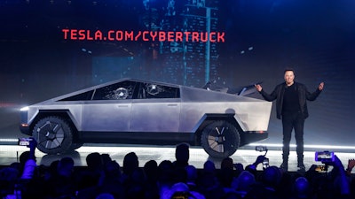Tesla CEO Elon Musk introduces the Cybertruck at Tesla's design studio on Nov. 21, 2019, in Hawthorne, Calif. The windows were broken during a demonstration intended to show the strength of the glass. Musk is expected to give an update on manufacturing problems with the long-awaited Cybertruck at an event Thursday marking the first deliveries of the futuristic, angular pickup truck.