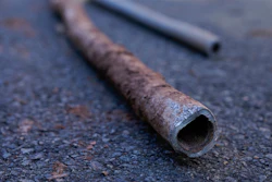 Lead water pipes pulled from underneath the street are seen in Newark, N.J., Oct. 21, 2021.