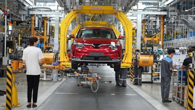 Workers assemble a car at a Vinfast factory in Hai Phong, Vietnam, on Sept. 29, 2023.