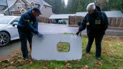 This photo released by the National Transportation Safety Board shows the door plug from Alaska Airlines Flight 1282 on Monday, Jan. 8, 2024, in Portland, Ore. A panel used to plug an area reserved for an exit door on the Boeing 737 Max 9 jetliner blew out Jan. 5, shortly after the flight took off from Portland, forcing the plane to return to Portland International Airport.