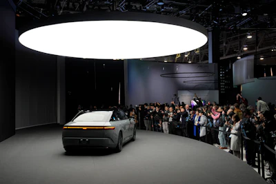People take pictures of an Afeela EV during a Sony press conference ahead of the CES tech show Monday, Jan. 8, 2024, in Las Vegas.