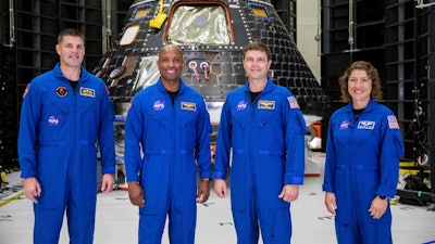 Artemis II crew members, from left, Jeremy Hansen, Victor Glover, Reid Wiseman and Christina Koch, stand together at NASA's Kennedy Space Center in Florida, in front of an Orion crew module on Tuesday, Aug. 8, 2023.