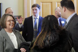 Kansas Supreme Court Chief Justice Marla Luckert, left, chats with spectators who have gathered for a joint meeting of the Kansas House and Senate Judiciary committees.