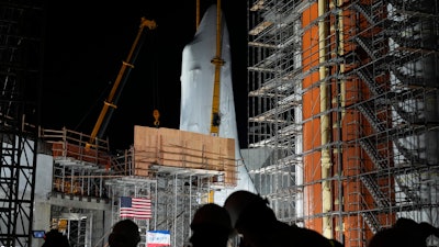 Space Shuttle Endeavour is lifted into the site of the future Samuel Oschin Air and Space Center on Monday, Jan. 29, 2024, in Los Angeles.