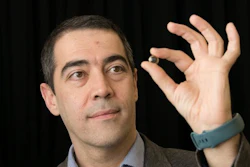 Professor Hamdi Torun pictured with the contact lens.
