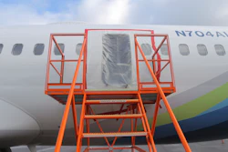 This photo released by the National Transportation Safety Board shows a gaping hole where the paneled-over door had been at the fuselage plug area of Alaska Airlines Flight 1282 on Sunday, Jan. 7, 2024, in Portland, Ore.