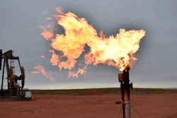 A flare burns natural gas at an oil well Aug. 26, 2021, in Watford City, N.D.