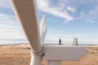 This undated image provided by GE Vernova shows a worker atop a wind turbine at the Borderland Wind Project in western New Mexico near the Arizona state line.