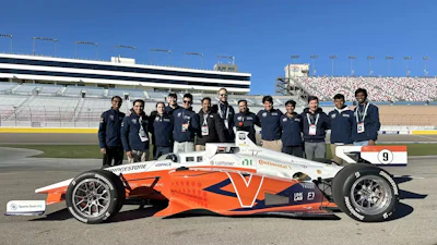 The Cavalier Autonomous Racing team stands behind their driverless race car.