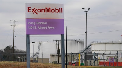 A sign marks the entrance to an ExxonMobil fuel storage and distribution facility in Irving, Texas, Jan. 25, 2023.