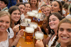 Women pose for a photo at the 188th Oktoberfest in Munich, Sept. 16, 2023.