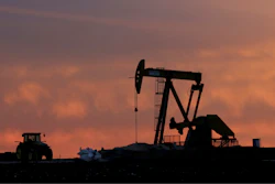 A well pump works at sunset on a farm near Sweetwater, Texas, on Dec. 22, 2014.