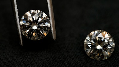 A lab grown diamond, left, and a natural diamond are displayed at Bario Neal, a jewelry store, in Philadelphia, Wednesday, Feb. 7, 2024.