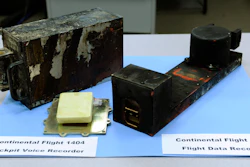 The cockpit voice recorder, left, and the flight data recorder from Continental flight 1404 airplane accident on display at the National Transportation Safety Board headquarters in Washington, Dec. 22, 2008.