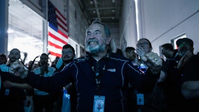 Main Engine Control Computer designer for Intuitive Machines Dan Harrison cheers amongst fellow employees during a watch party moments after they became the first commercial company to softly land on the moon on Thursday, Feb. 22, 2024, in Houston.