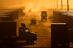 Workers drive among shipping containers and trailers at a BNSF intermodal terminal, Edgerton, Kan., Jan. 3, 2024.