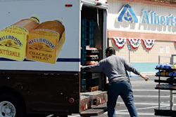 Mitch Maddox loads bread outside the Eagle Rock Albertsons store in Los Angeles, May 30, 2006.