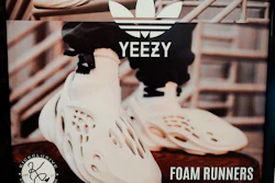 A sign advertises Yeezy shoes made by Adidas at Kickclusive, a sneaker resale store, in Paramus, N.J., Oct. 25, 2022.