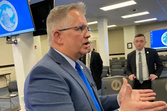 Kentucky state Sen. Danny Carroll speaks with reporters, Feb. 20, 2024, in Frankfort, Ky.