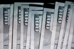 U.S. $100 bills are seen, Thursday, July 14, 2022, in Marple Township, Pa.