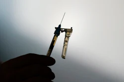 A syringe is prepared at a clinic in Norristown, Pa., Dec. 7, 2021. The Environmental Protection Agency finalized a rule Thursday, March 14, 2024, imposing stricter limits on a chemical used to sterilize medical equipment after finding a higher-than-expected cancer risk at facilities that use ethylene oxide to clean billions of devices including catheters and syringes.
