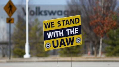 A 'We stand with the UAW' sign is placed outside of the Volkswagen plant in Chattanooga, Tenn., on Dec. 18, 2023.