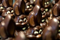 Chocolate rabbits wait to be decorated at the Cocoatree chocolate shop, April 8, 2020, in Lonzee, Belgium.