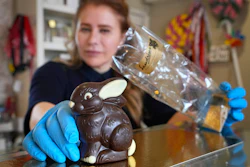 Niaz Mardan wraps a Belgian chocolate rabbit at Sandrine, London, March 21, 2024.