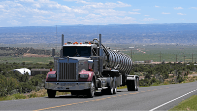 A tanker truck transports crude oil on a highway near Duchesne, Utah on July 13, 2023.