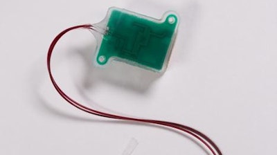 The soft, stretchable sensor is the elongated section near the tip of the tweezers. The green box is the implantable 'base station,' which holds electrical components to power the device and wirelessly transmit data.