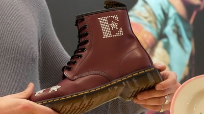 A Dr Martens boot inspired by Elton John's famous Pinball Wizard outfit is shown at a promotional event in London, March 20, 2023.