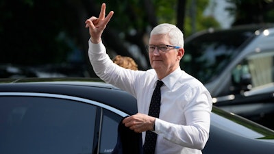 Apple CEO Tim Cook gestures upon the arrival for a meeting with Indonesian President Joko Widodo at palace in Jakarta, Indonesia, Wednesday, April 17, 2024.