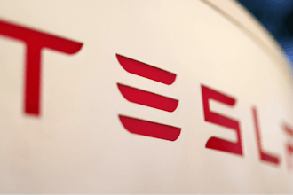 The logo for the Tesla Supercharger station is seen in Buford, Ga, April 22, 2021.