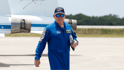 NASA astronaut Butch Wilmore, walks past NASA jets after he arrived at the Kennedy Space Center, Thursday, April 25, 2024, in Cape Canaveral, Fla.