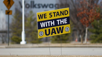 A 'We stand with the UAW' sign appears outside of the Volkswagen plant in Chattanooga, Tenn., on Dec. 18, 2023.