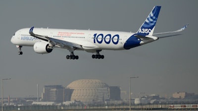 An Airbus A350 prepares to land at the Dubai Air Show, United Arab Emirates, Nov. 14, 2023. In the latest round of their decades-long battle for dominance in commercial aircraft, Europe's Airbus has established a clear sales lead over Boeing as the American company deals with the fallout from manufacturing troubles and ongoing safety concerns.