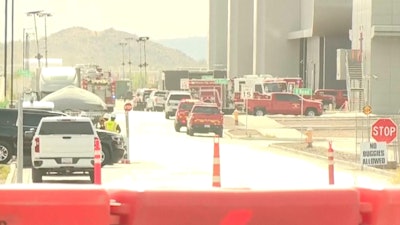 This image made from video provided by ABC15 shows emergency vehicles as they respond to the TSMC semiconductor plant under construction in Phoenix, Wednesday, May 15, 2024, after a worker was fatally injured when a tank holding waste material depressurized.