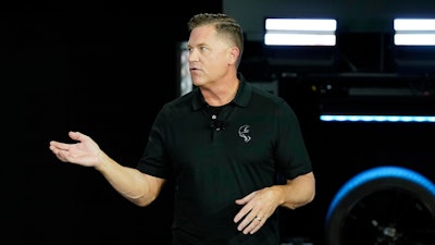 Tim Kuniskis, head of Dodge Brand talks about the Dodge Charger Daytona SRT concept before its unveiling on Aug. 17, 2022, in Pontiac, Mich. Kuniskis, the unofficial voice of American muscle cars, is retiring from Stellantis after nearly 32 years with the company.