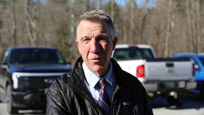 Vermont Republican Gov. Phil Scott arrives at his polling place in Berlin, Vt., on Tuesday Nov. 8, 2022. On Thursday, May 30, 2024, Vermont has become the first state to enact a law requiring fossil fuel companies to pay a share of the damage caused by climate change after the state suffered catastrophic summer flooding and damage from other extreme weather.