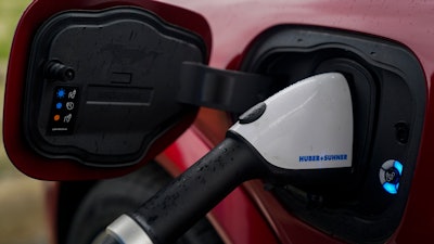 A 2023 Ford Mustang Mach-E charges, Friday, March 8, 2024, at an electric vehicle charging station in London, Ohio.