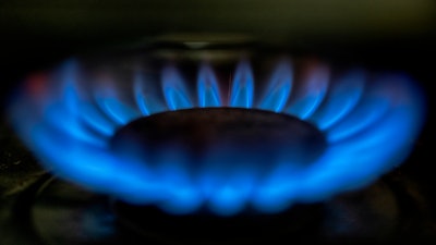 A gas-lit flame burns on a natural gas stove, March 26, 2024, in Los Angeles.