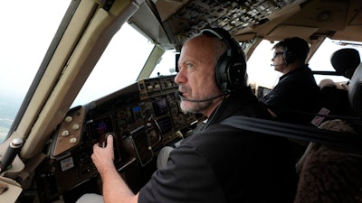 Honeywell test pilots Joe Duval, left, and Clint Coatney fly a Boeing 757 test aircraft demonstrating runway hazard warning systems over the airport in Tyler, Texas, Tuesday, June 4, 2024.
