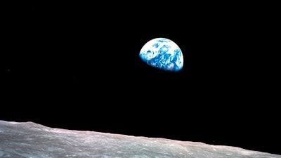 This Dec. 24, 1968, file photo made available by NASA shows the Earth behind the surface of the moon during the Apollo 8 mission.